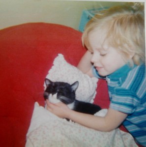 Kristene Perron as a child with cat